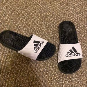 White and black Adidas slip on sandals